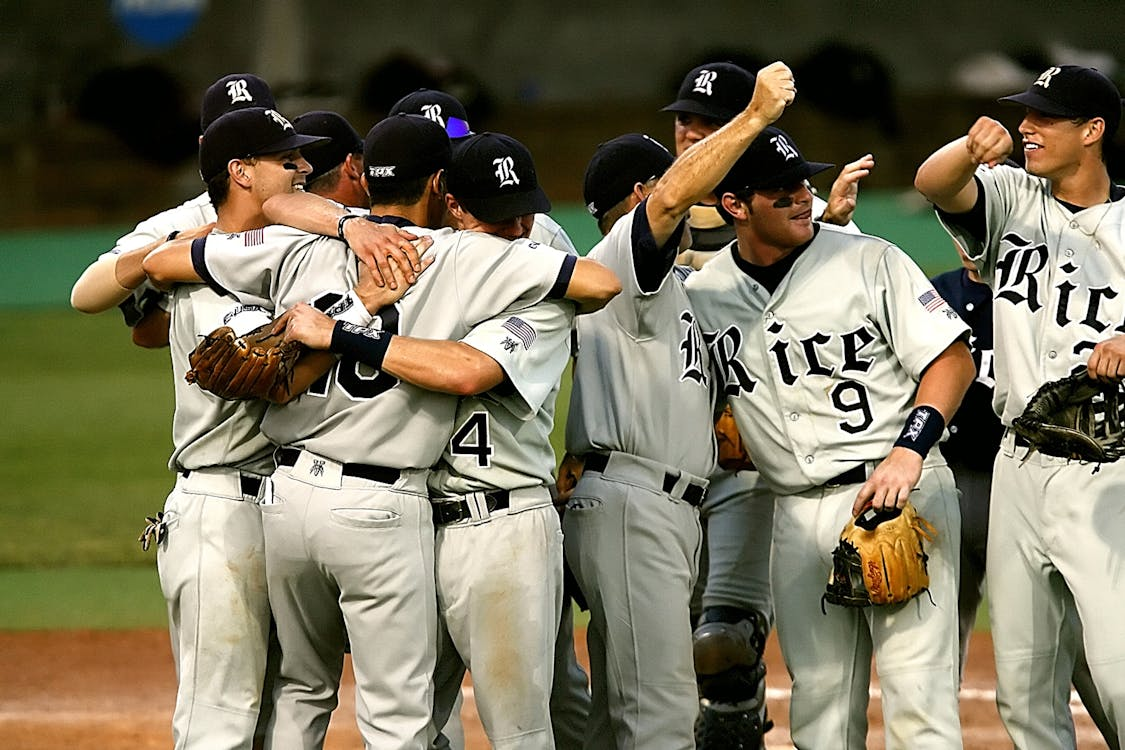 Rice baseball team celebrating on the field
